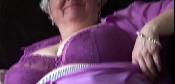  Mature granny with massive tits and hairy bush stripping and teasing